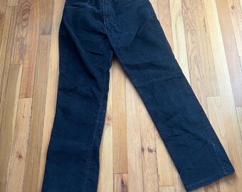 May include: A pair of black corduroy pants.