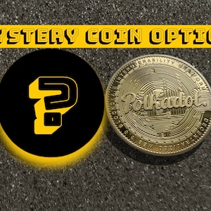 May include: A gold coin with the text "Polkadot" and "Blockchain Interoperability Platform" around the edge. The coin is on a gray surface next to a black circle with a yellow question mark.