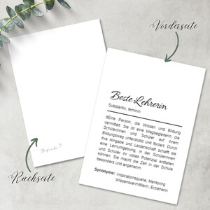 May include: A white card with black text that reads "Beste Lehrerin" (Best Teacher) and defines the word as a noun, feminine. The text also includes a definition of the word and synonyms. The card has the words "Vorderseite" (front) and "Ruckseite" (back) written on it.