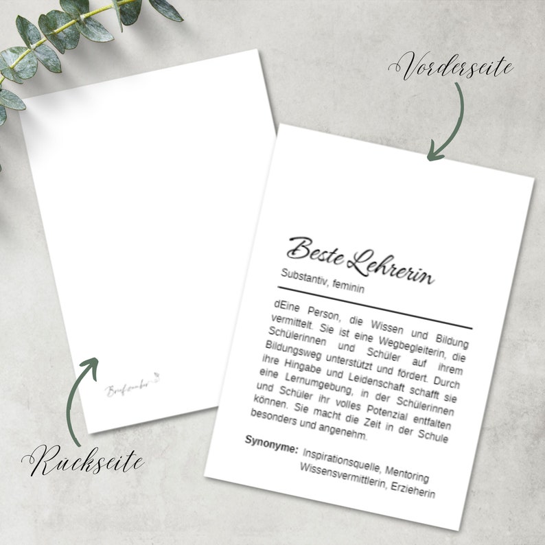 May include: A white card with black text that reads "Beste Lehrerin" (Best Teacher) and defines the word as a noun, feminine. The text also includes a definition of the word and synonyms. The card has the words "Vorderseite" (front) and "Ruckseite" (back) written on it.