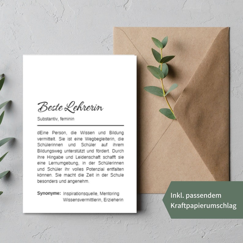 May include: A white card with black text that reads "Beste Lehrerin" (Best Teacher) and defines the word as a person who conveys knowledge and education. The card also includes synonyms for the word, such as "Inspirationsquelle" (source of inspiration), "Mentoring", "Wissensvermittlerin" (knowledge mediator), and "Erzieherin" (educator). The card is accompanied by a brown paper envelope.