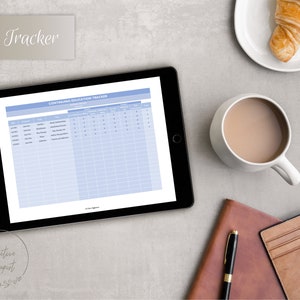 May include: A digital tablet displaying a blue and white printable continuing education tracker. The tracker has columns for date, topic, provider, hours, and other information. The text "CONTINUING EDUCATION TRACKER" is at the top of the page.