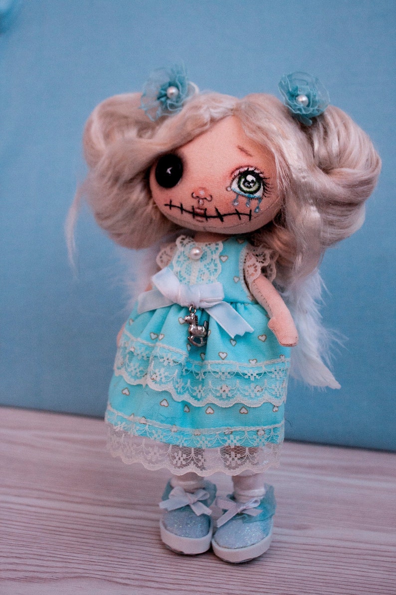 Little blue angel creepy art doll with button eyes. Gothic art u Little blue angel creepy art doll with button eyes. Gothic art u