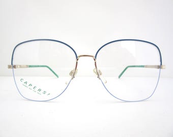Monturas de gafas para mujer, semi al aire, azules y verdes, fabricadas en Japón. Nuevas, de stock antiguo.