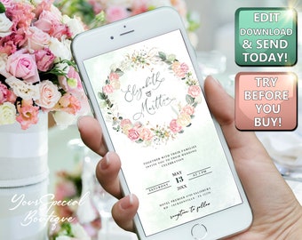 以下が含まれることがあります： スマートフォンには、花のリースデザインの結婚式の招待状が表示されています。招待状には、名前、日付、時間、場所の詳細が含まれています。電話には「Edit, Download & Send Today!」と「Try Before You Buy!」というテキストも表示されています。