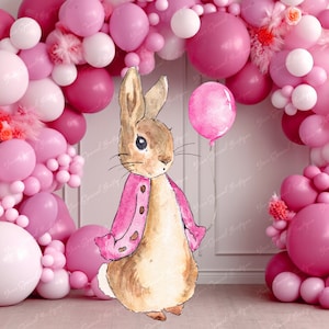 May include: A pink and white balloon arch with a brown rabbit holding a pink balloon. The rabbit is wearing a pink jacket.