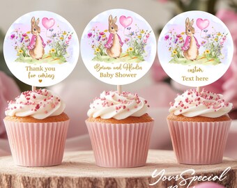 May include: Three cupcake toppers featuring a watercolor illustration of a bunny rabbit holding a pink heart balloon. The toppers are decorated with flowers and greenery. The text on the toppers reads "Thank you for coming", "Briana and Aladin Baby Shower", and "custom Text here".