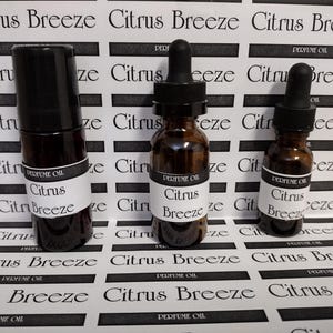 May include: A set of three ceramic mugs with a speckled, matte finish. The mugs are in shades of cream, light gray, and dark gray. Each mug has a simple, minimalist design and a rounded handle. The mugs are stacked on top of each other.