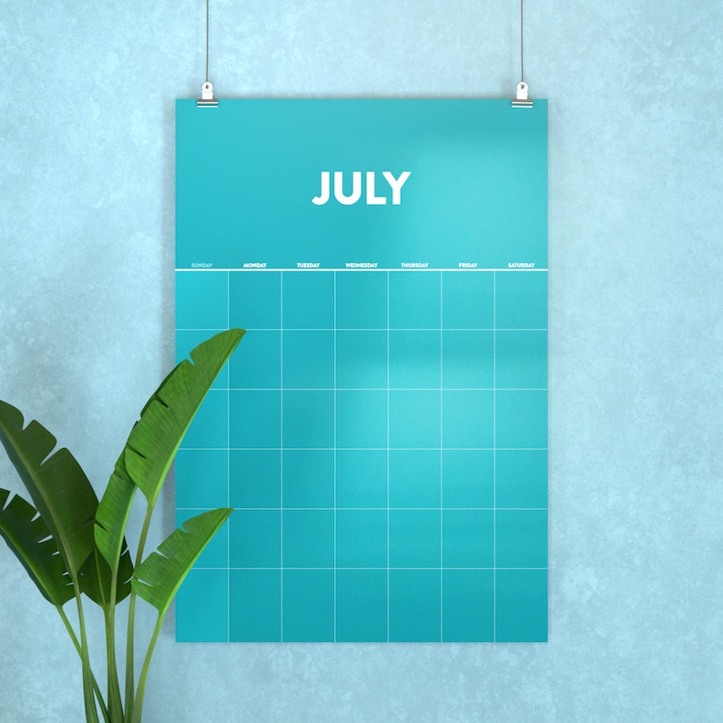 May include: A turquoise blue monthly calendar with the word "JULY" printed in white at the top. The calendar has a grid layout with days of the week labeled at the top.