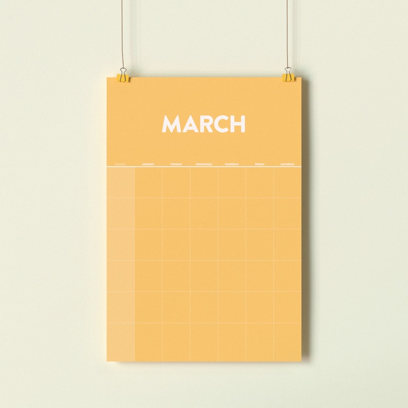May include: A yellow calendar with the word "MARCH" printed in white at the top. The calendar has a grid layout with days of the week labeled at the top.