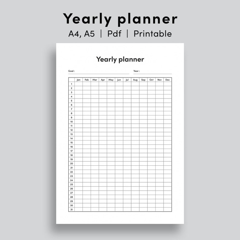 May include: A black and white printable yearly planner with a grid layout. The planner has a section for goals, year, and each month of the year. The planner is designed for use with a pen or pencil.