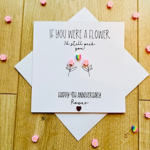 Tarjeta con tema de flores para el cuarto aniversario de bodas