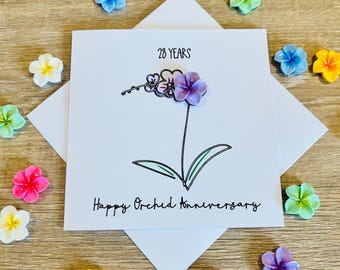 Tarjeta de aniversario de bodas número 28 con orquídeas