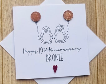 Carte 19e anniversaire en bronze, pingouins mignons