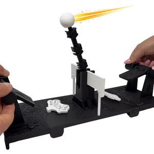 May include: A black tabletop game with a white ball and a net. The game has two black levers and a white decorative piece. A yellow and orange streak emanates from the ball. The game is designed for two players.