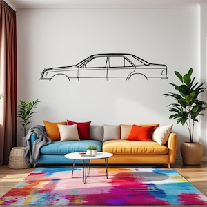 May include: A living room with a blue and yellow sofa, a black coffee table, and a colourful rug. A black and white outline of a car is on the wall.