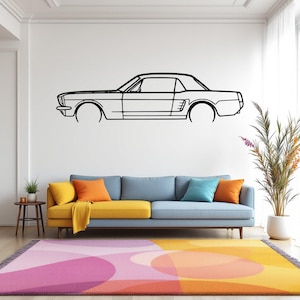 May include: A black and white line drawing of a classic car, a Ford Mustang, on a white wall above a blue and yellow sofa. The sofa is in a living room with a pink and orange patterned rug.