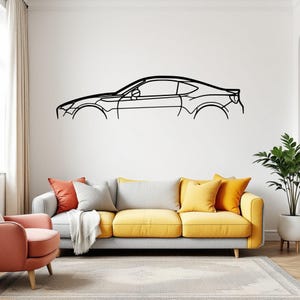 May include: A black metal wall art piece featuring the minimalist outline of a sports car in profile. The design consists of a single continuous line depicting the silhouette of the vehicle, including the roofline, windows, and wheel arches.
