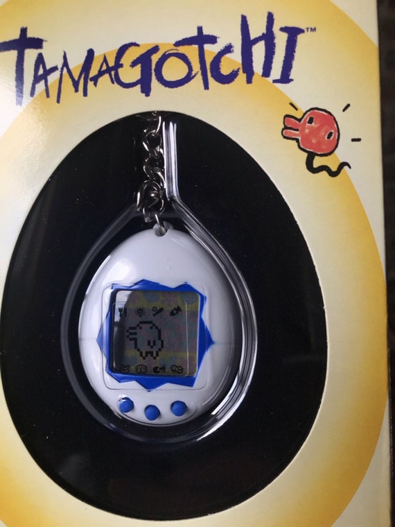 BANDAI ORIGINAL Tamagotchi White With Blue Detail - #1800, 1996