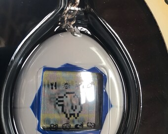 BANDAI ORIGINAL Tamagotchi White With Blue Detail - #1800, 1996