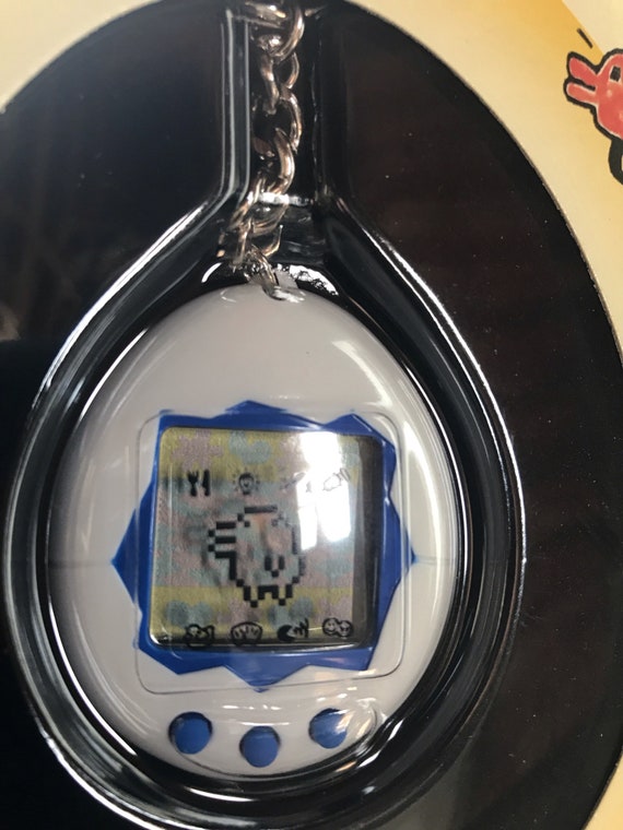 BANDAI ORIGINAL Tamagotchi White With Blue Detail - #1800, 1996