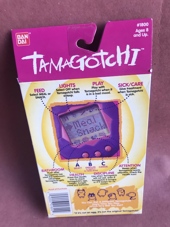 BANDAI ORIGINAL Tamagotchi White With Blue Detail - #1800, 1996