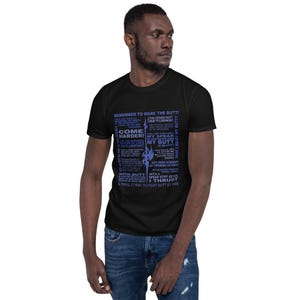 May include: Black t-shirt with blue text that reads "REMEMBER TO WARE THE BUTT!" and "COME HARDER!" along with other phrases. A stylized graphic of a spear is also included in the design.