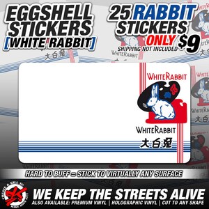 May include: A pack of 25 eggshell stickers featuring a white rabbit with the text "White Rabbit" and "大白兔" in red and blue. The stickers are hard to buff and can be applied to virtually any surface. The text "We Keep The Streets Alive" is also included.