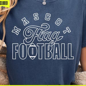 May include: Navy blue t-shirt with white text reading "Mascot Flag Football" and a football graphic. The shirt also features the text "Midday SVG" and "Font Included for Mascot".