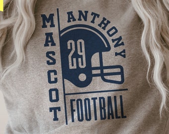 May include: Gray sweatshirt with a navy blue design. The design includes the text "MASCOOT", "ANTHONY", "FOOTBALL", and the number "29" inside a football helmet.