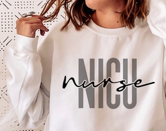 May include: White sweatshirt with the text "NICU nurse" in black and gray lettering.