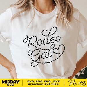 May include: White t-shirt with a black design that says "Rodeo Gal" in a rope-like font.