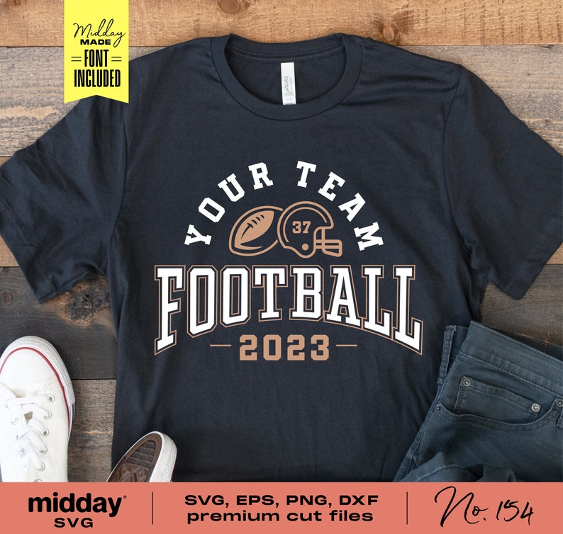 May include: A black t-shirt with a white graphic design that says "Your Team Football - 2023" with a brown football and helmet graphic.