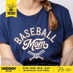 May include: A navy blue t-shirt with the text "BASEBALL Mom" in white with a baseball bat and ball graphic with the number 23. The text "Midday MADE =FONT= INCLUDED" is in a yellow banner at the top left of the image.