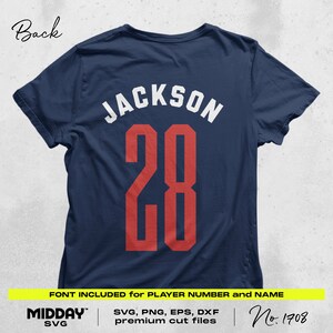 May include: A navy blue t-shirt with the name "JACKSON" and the number "28" printed on the back in white and red. The text "FONT INCLUDED for PLAYER NUMBER and NAME" is printed below the number. The text "MIDDAY SVG" is printed in the bottom left corner. The text "SVG, PNG, EPS, DXF premium cut files" is printed in the bottom center. The text "No. 1708" is printed in the bottom right corner.