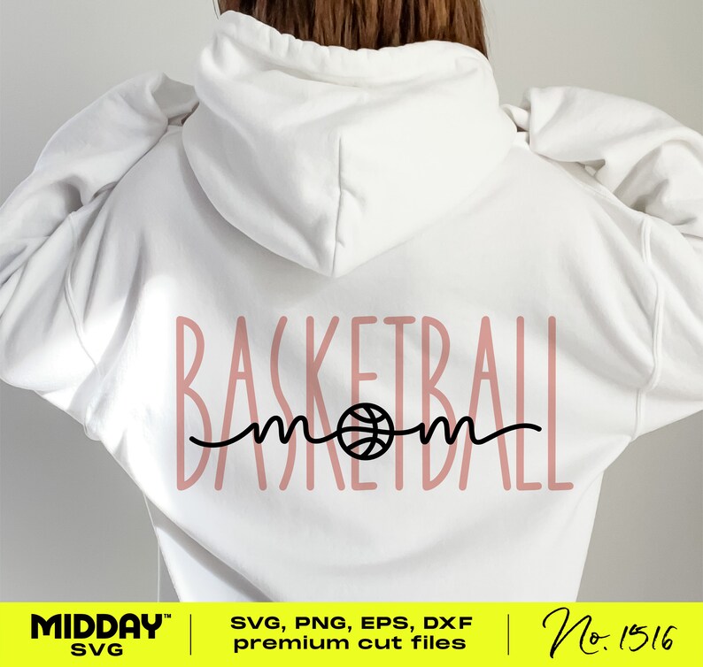 May include: A white hoodie with a pink design that says "Basketball Mom" with a basketball graphic in the middle of the word "mom".