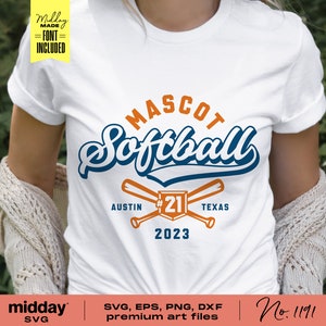 May include: A white t-shirt with a blue and orange softball design. The design includes the text "MASCOT Softball", "AUSTIN", "#21", "TEXAS", and "2023".