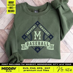 May include: Green sweatshirt with a baseball-themed design. The design features a diamond shape with a baseball bat and ball, the letter "M", and the text "Austin Mascot Baseball 20 24".