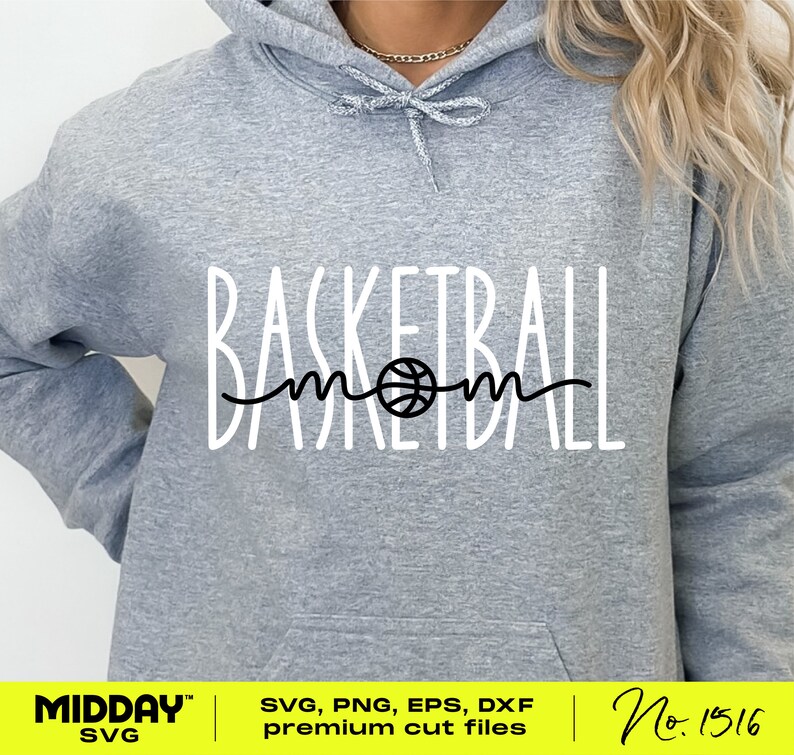 May include: A gray hoodie with the text "Basketball mom" in white with a black basketball graphic in the middle of the word "mom".