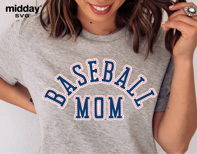 May include: A gray t-shirt with a blue and red baseball mom graphic. The graphic has a stitched look with a white outline.