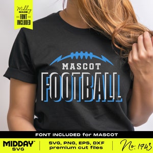 May include: A black t-shirt with a blue and white graphic design that says "MASCOT FOOTBALL". The graphic features a stylized football with lightning bolts. The text "FONT INCLUDED for MASCOT" is at the bottom of the image. The text "MIDDAY SVG" is in the lower left corner of the image. The text "No. 1743" is in the lower right corner of the image.