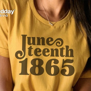 May include: A yellow t-shirt with the text "Juneteenth 1865" in brown lettering. The text is styled with a retro font.