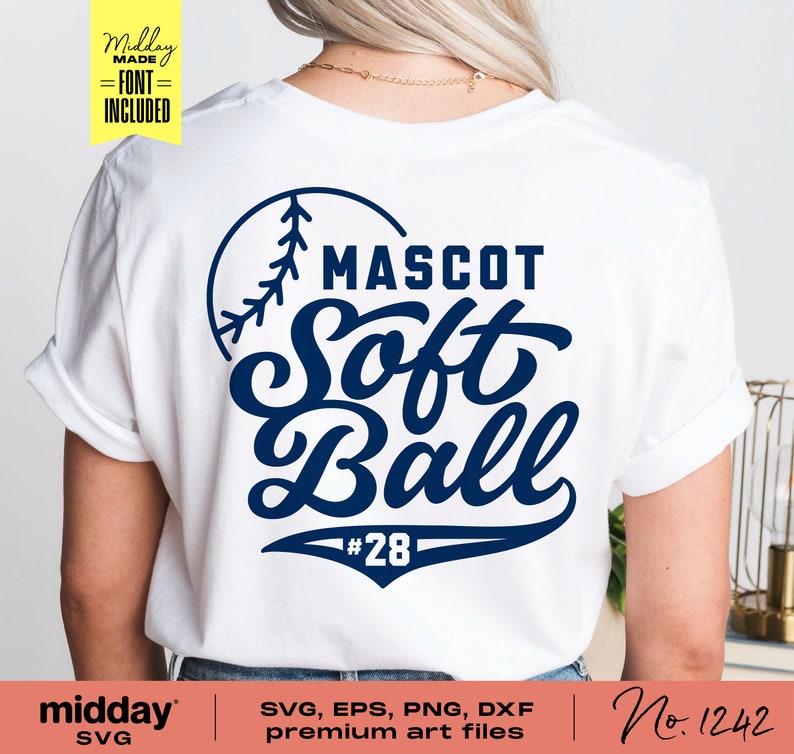 May include: A white t-shirt with a blue softball design. The design includes a baseball with stitching, the words "MASCOT Soft Ball", and the number "28".