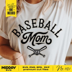 May include: A white t-shirt with a black and gold graphic that says "BASEBALL Mom" with two crossed baseball bats and the number 23. The graphic is in a vintage style font.