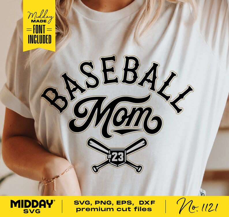 May include: A white t-shirt with a black and gold graphic that says "BASEBALL Mom" with two crossed baseball bats and the number 23. The graphic is in a vintage style font.