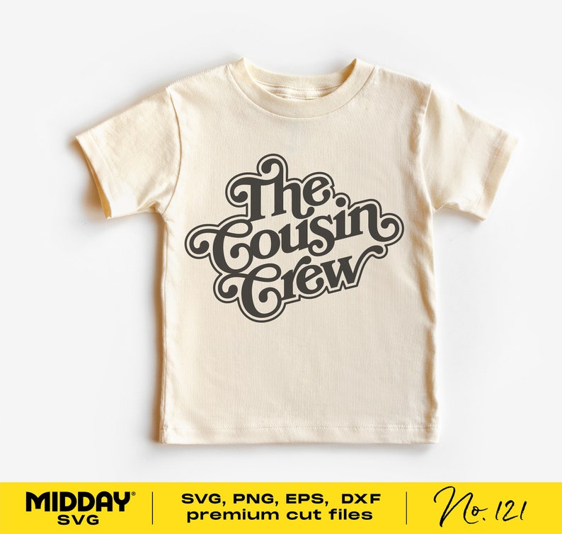 May include: A beige t-shirt with a black graphic that says "The Cousin Crew" in a retro font.