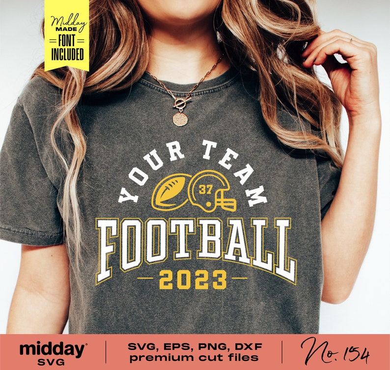 May include: A gray t-shirt with a yellow and white graphic design that says "Your Team Football - 2023". The graphic includes a football and a football helmet.