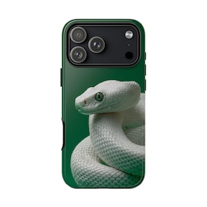 May include: A green phone case with a coiled white snake and green eyes. The case has a dark green border and a camera module at the top. The snake is the main subject, with its scales and eye details clearly visible.