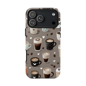 May include: A phone case featuring a repeating pattern of coffee cups, coffee beans, and white hearts on a brown backdrop. The coffee cups are in various styles, including lattes and cappuccinos. The case has a black camera module.