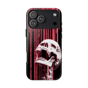 May include: Black iPhone case featuring a screaming skull graphic with red vertical lines and binary code. The case has a black border and a glossy finish, offering protection and a unique aesthetic.